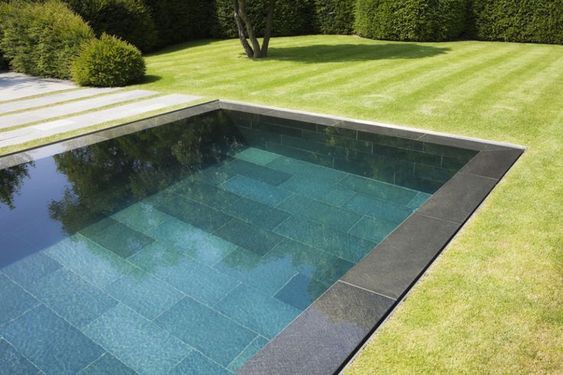 Mirror-edge pool integrated into a contemporary terrace