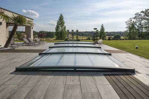 Low, flat Azenco pool enclosure, almost invisible