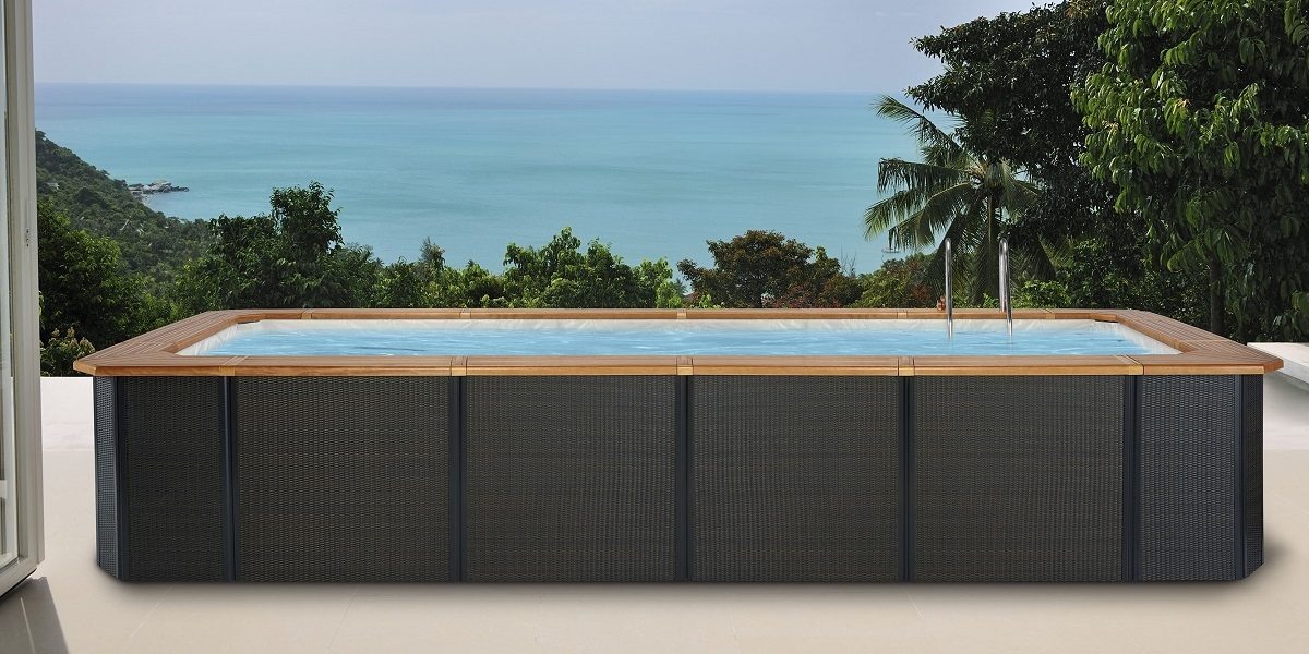 Technypools above-ground pool, Solar finish, rattan cladding and natural wood edge